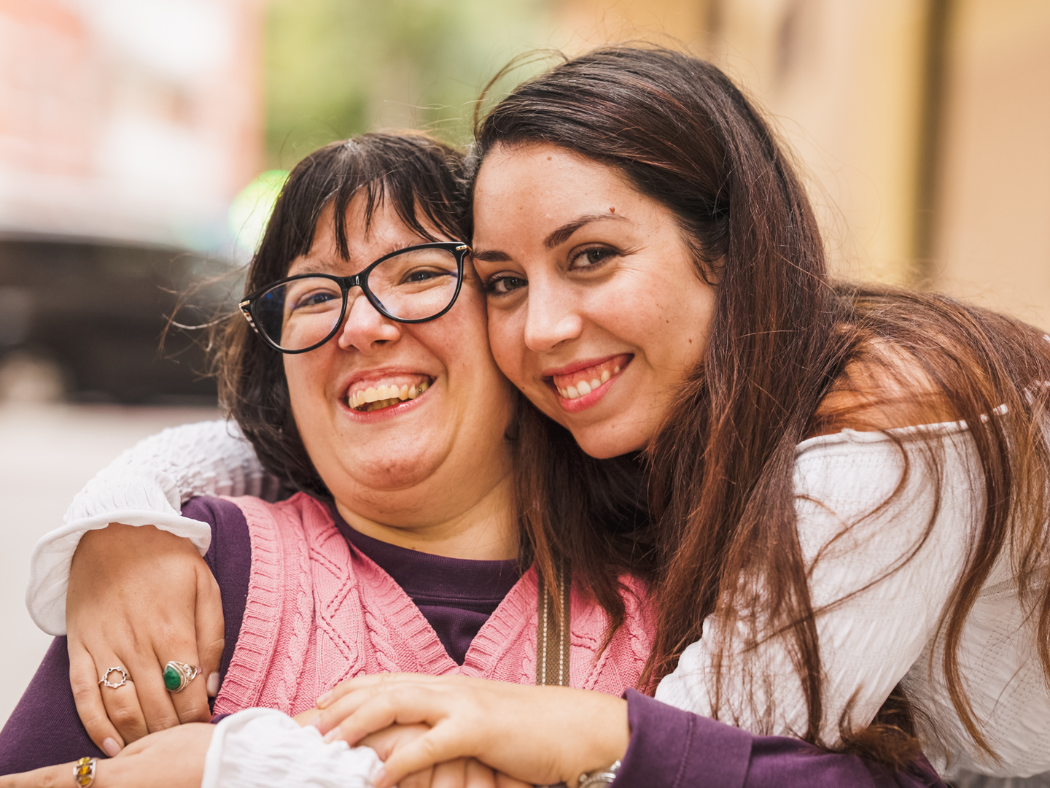 Smiling NDIS participant receiving community support