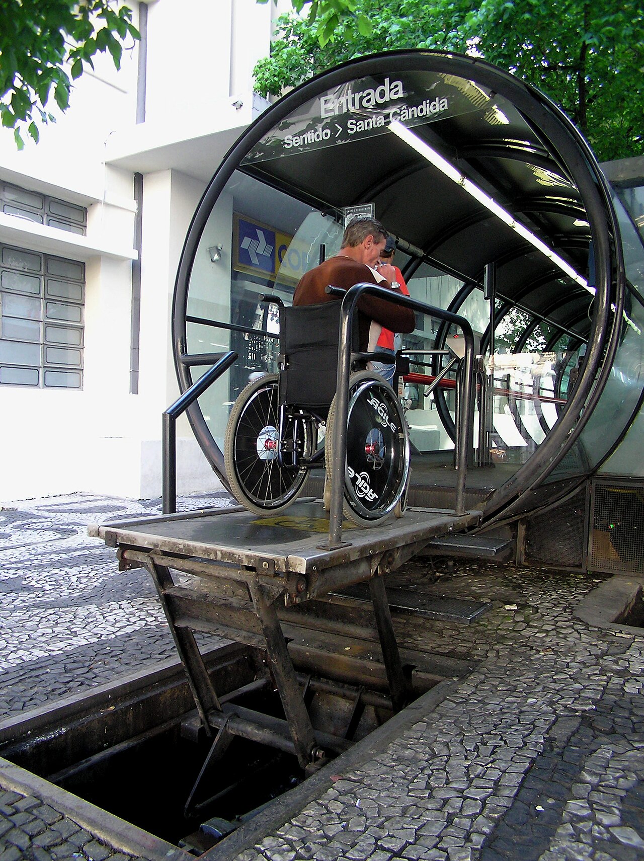 Participant in wheelchair boarding transport using an accessibility lift