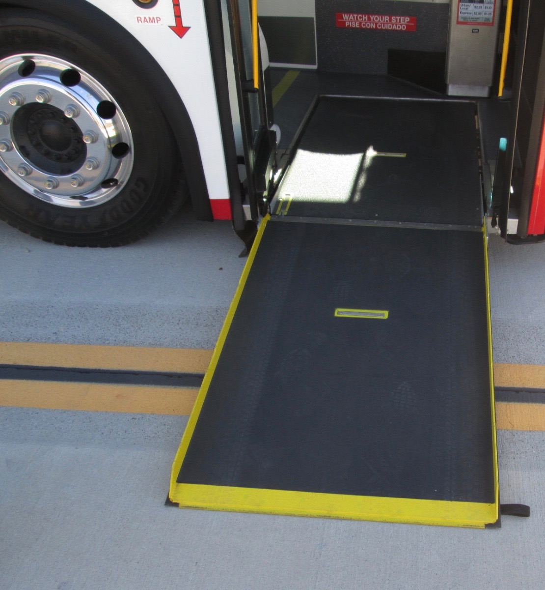 Accessible bus with wheelchair ramp deployed